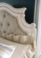 Realyn King Upholstered Panel Bed with Mirrored Dresser